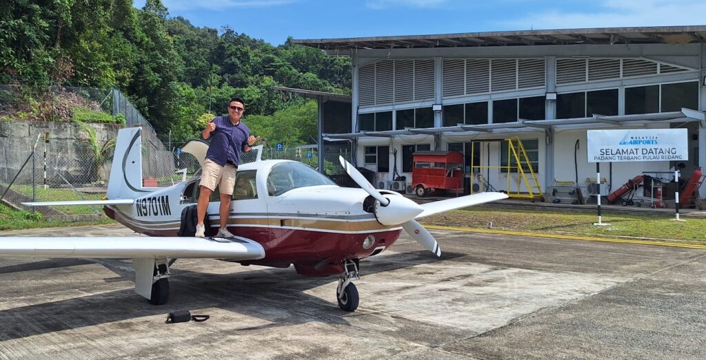 Ben Chong with his Mooney M20F in Redang Island.